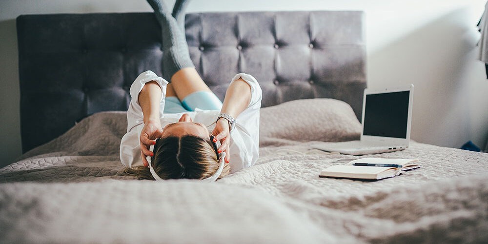 moneyplus woman listening to music songs about money