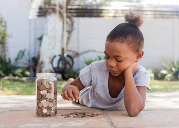 girl counting coins