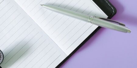 open notebook against light purple background