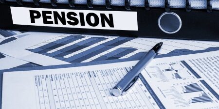Image of a black folder with labelled "pension" with a couple of forms and a silver pen.