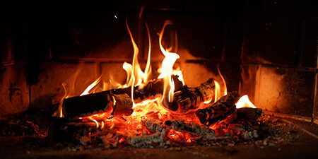 Image of fire blazing in a fireplace