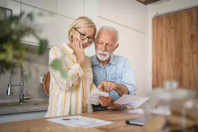 old couple reading a letter.