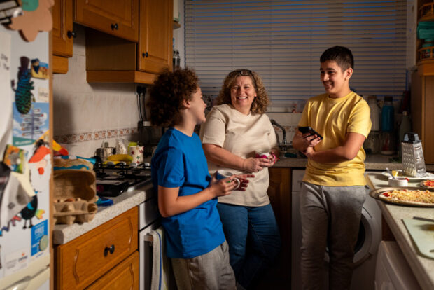 mother-sons-talking Mother and sons talking in the kitchen