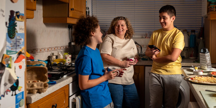 mother-sons-talking Mother and sons talking in the kitchen