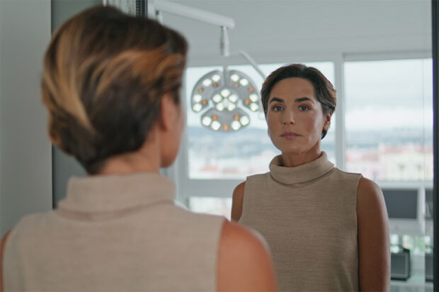 woman-looking-mirror Woman looking in the mirror