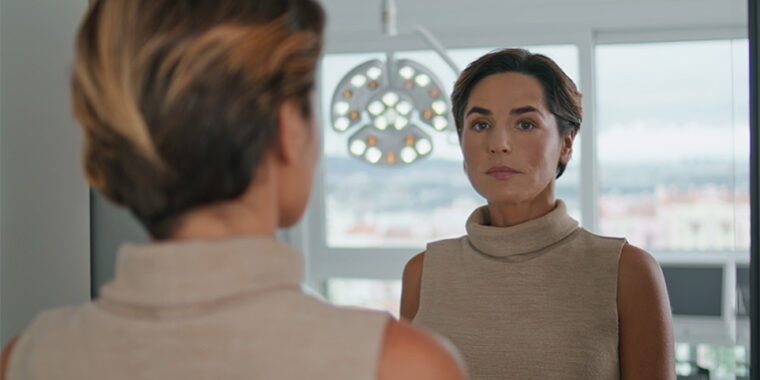 woman-looking-mirror Woman looking in the mirror
